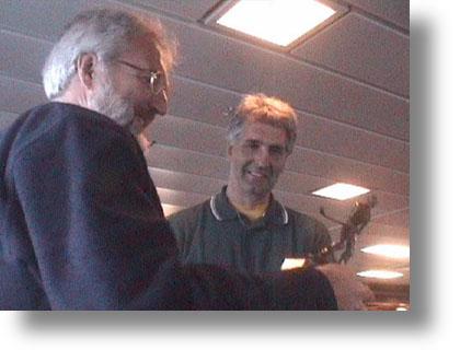 The 2002 Winner, Norrie Smith, receives the trophy from Ken Maxwell